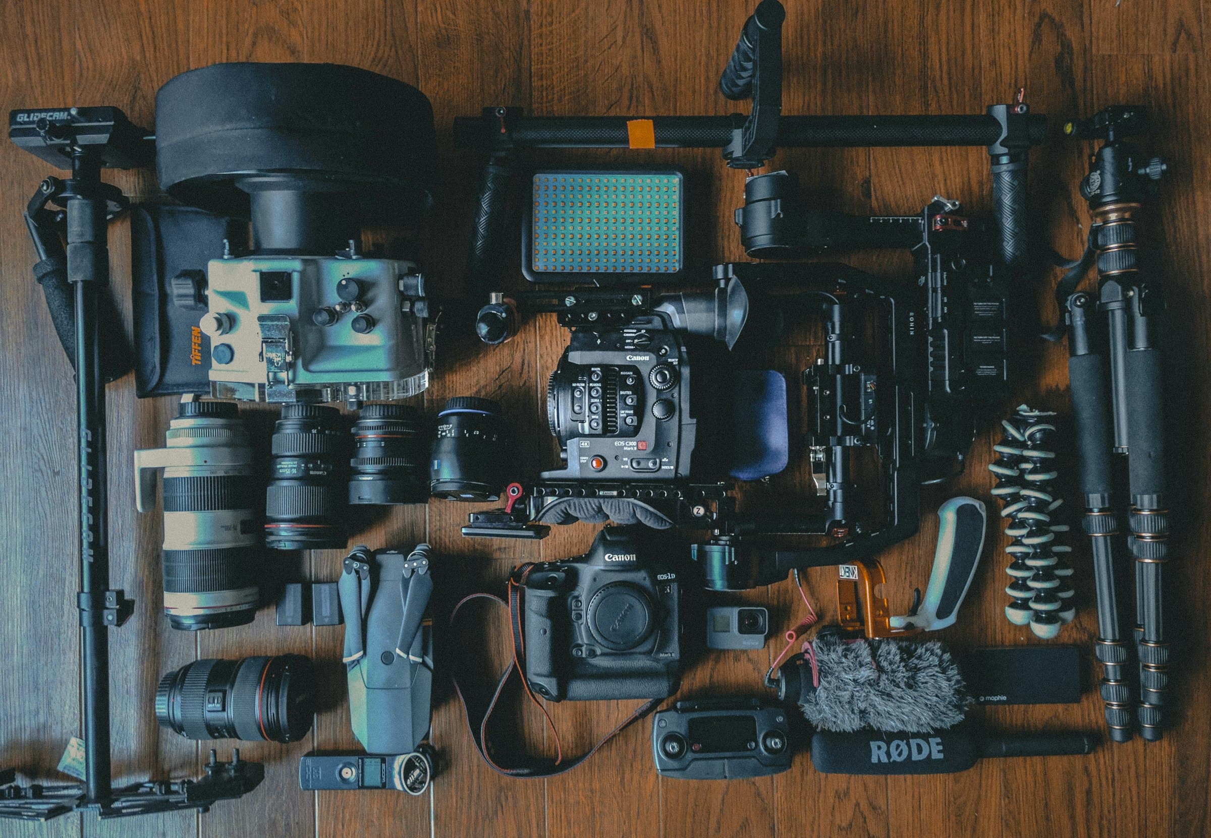 Content creation gear — cameras, lenses, gimbal, lighting, and audio laid out
